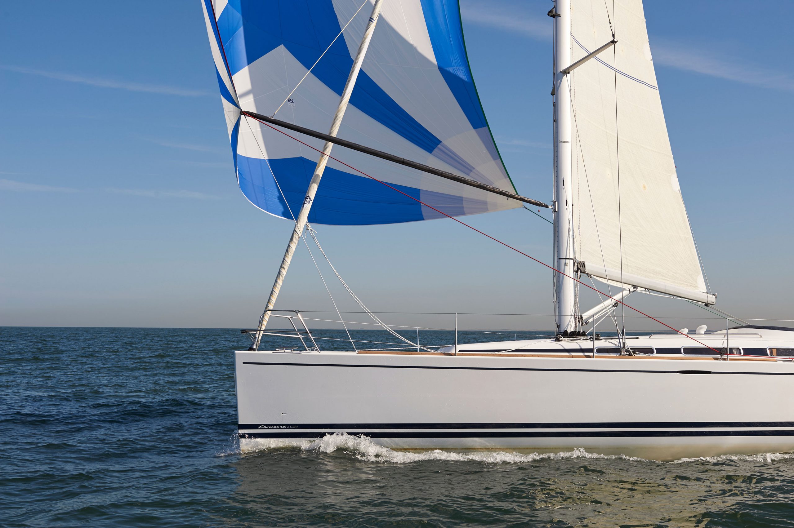 THE THRILL OF THE WIND FILLING THE SPINNAKER